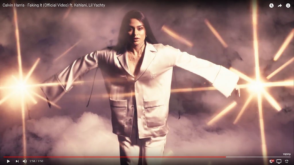 Kehlani wearing layered necklace in Faking It Music Video