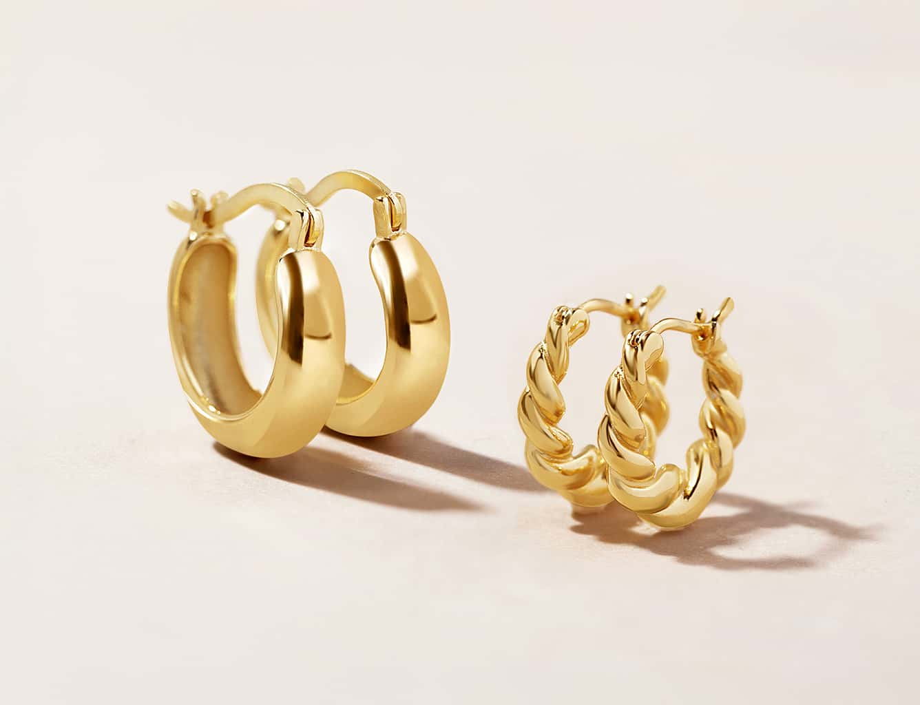 Chunky and twisted small gold hoop earrings by AMYO Jewelry