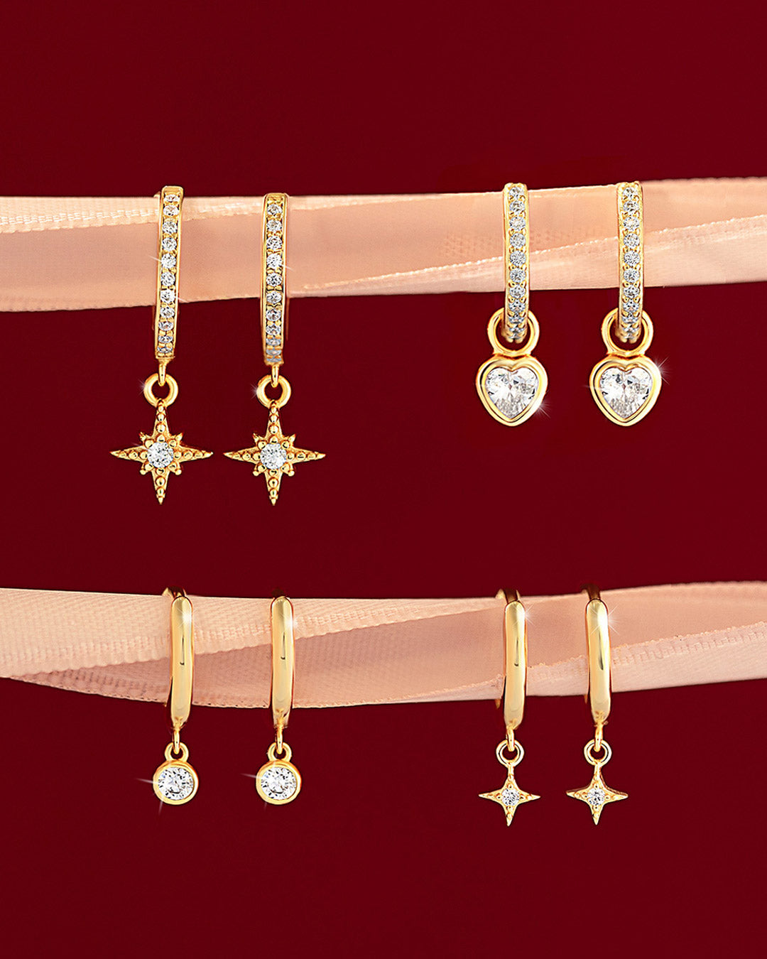 Shop AMYO gold huggie earrings with pavé stars, hearts, and crystal charms, perfect for stacking, gifting, and adding sparkle to everyday jewelry looks.