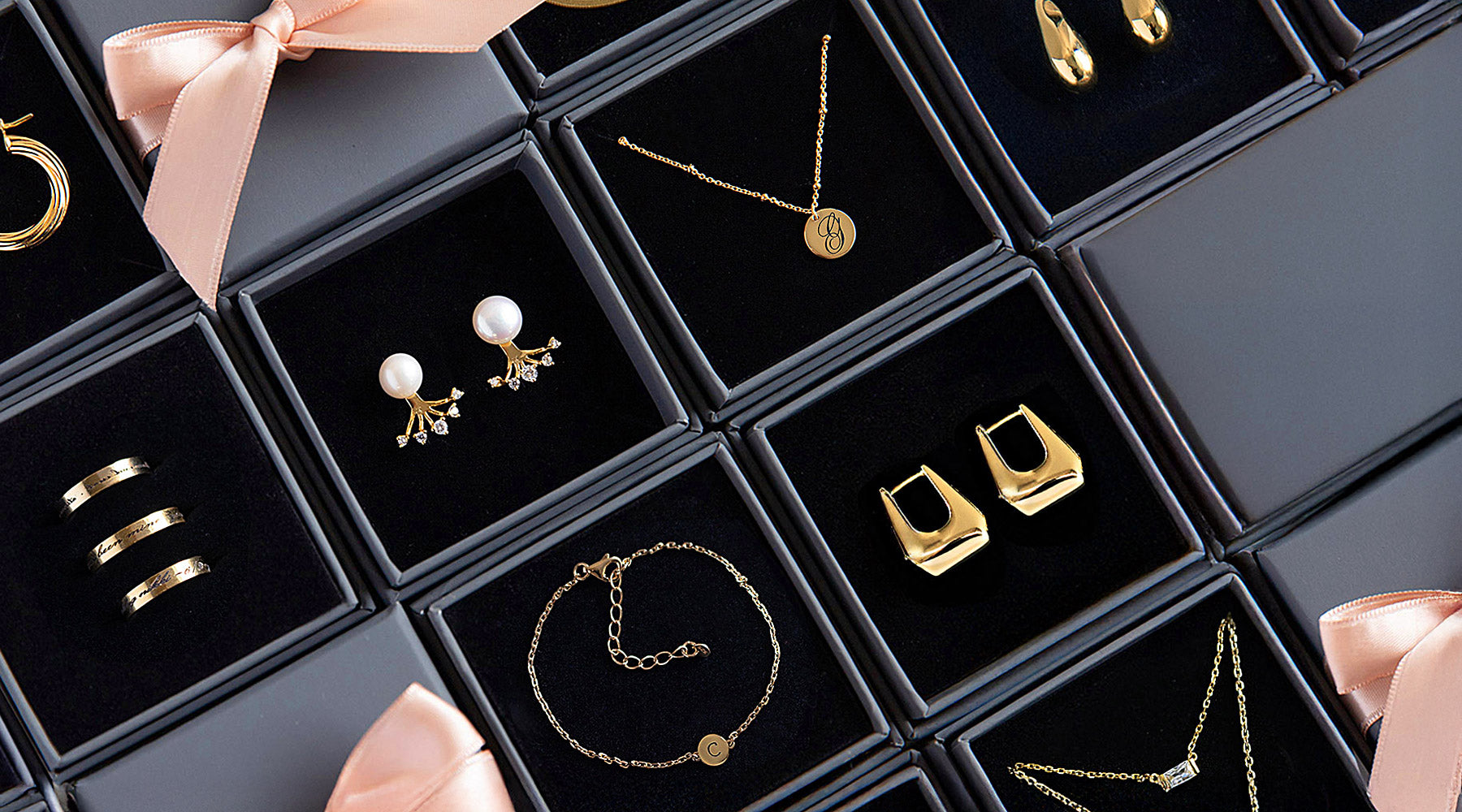 Valentines Day Gifts for Her, including hoop earrings, stud earrings, engraved bracelets and necklaces from AMYO.