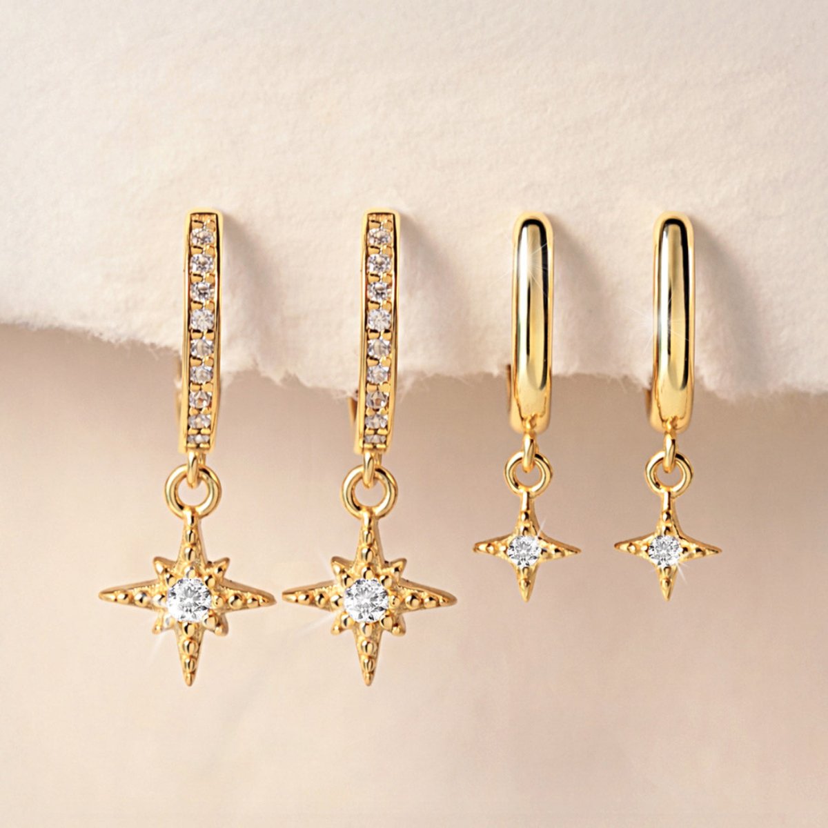 Set of gold vermeil starburst huggie earrings from AMYO