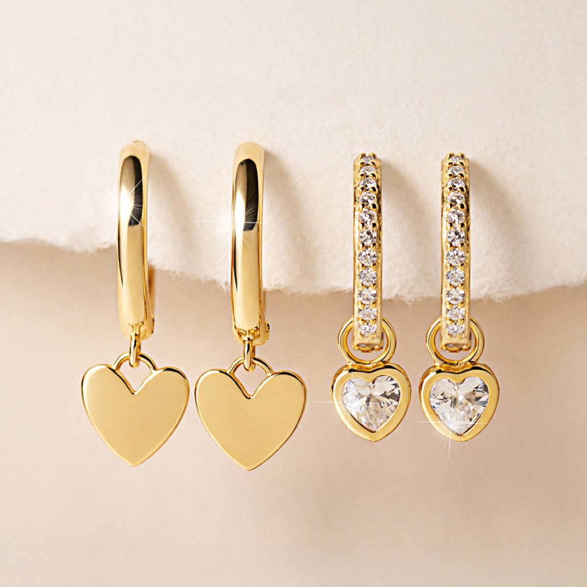 Two pairs of Gold Vermeil heart-shaped huggie earrings from AMYO