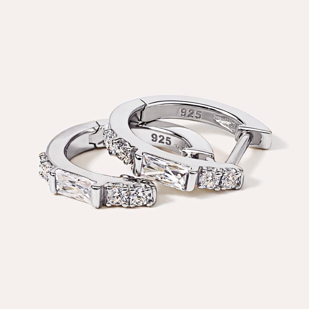 Close-up of AMYO's Baguette Huggie Earrings in Sterling Silver with CZ Crystals