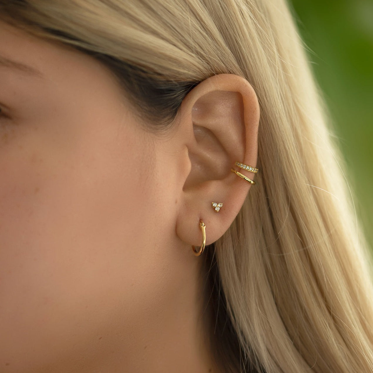 Curated Ear with Small Gold Hoop Earrings, Clover Stud Earring, Eternity and Pave Ear Cuff