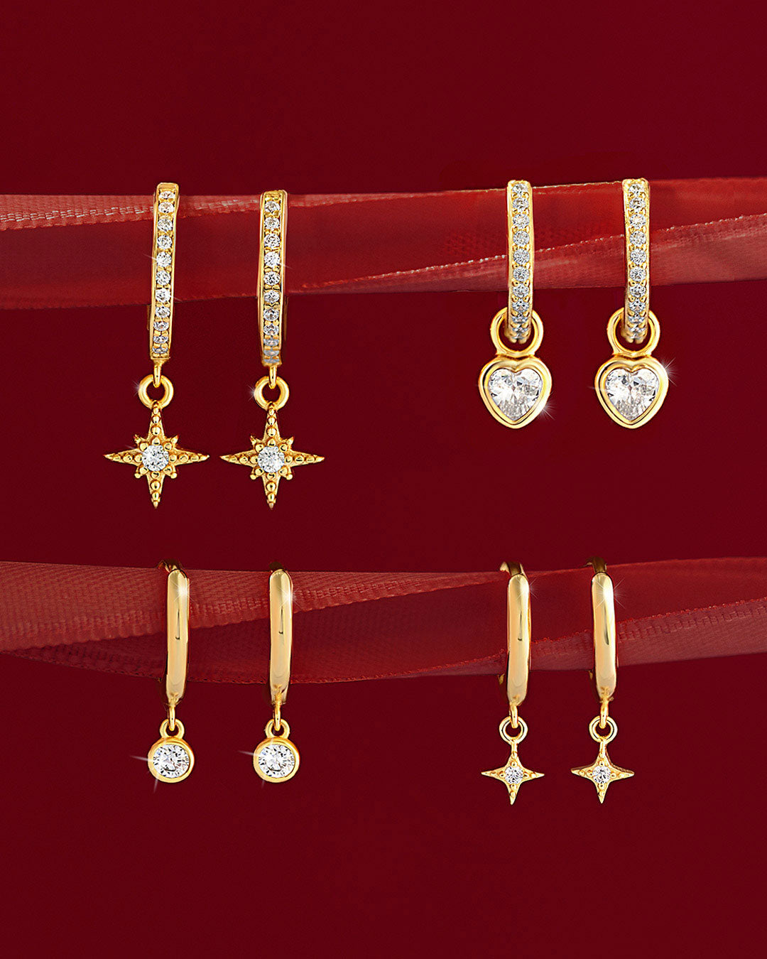Gold huggie earrings featuring hearts, stars and classic designs from AMYO, perfect for gifting.