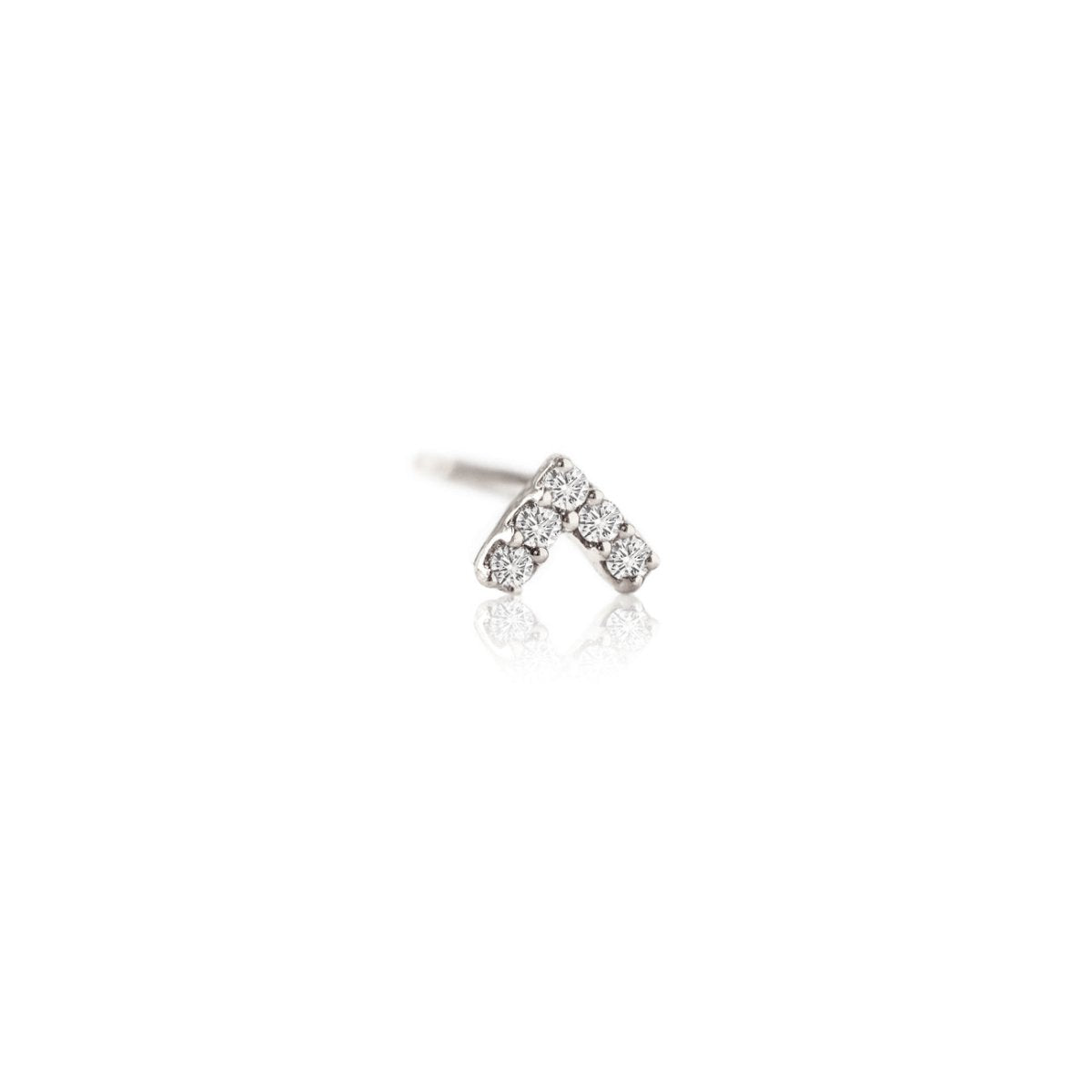 Tiny silver chevron stud earring paved with clear stones, on a white background.