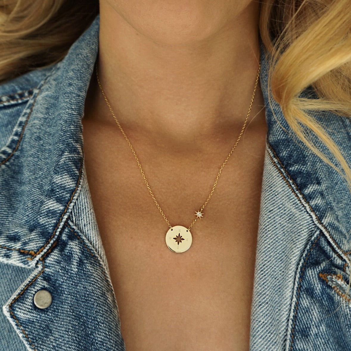 Gold Star Compass Necklace worn with jean jacket