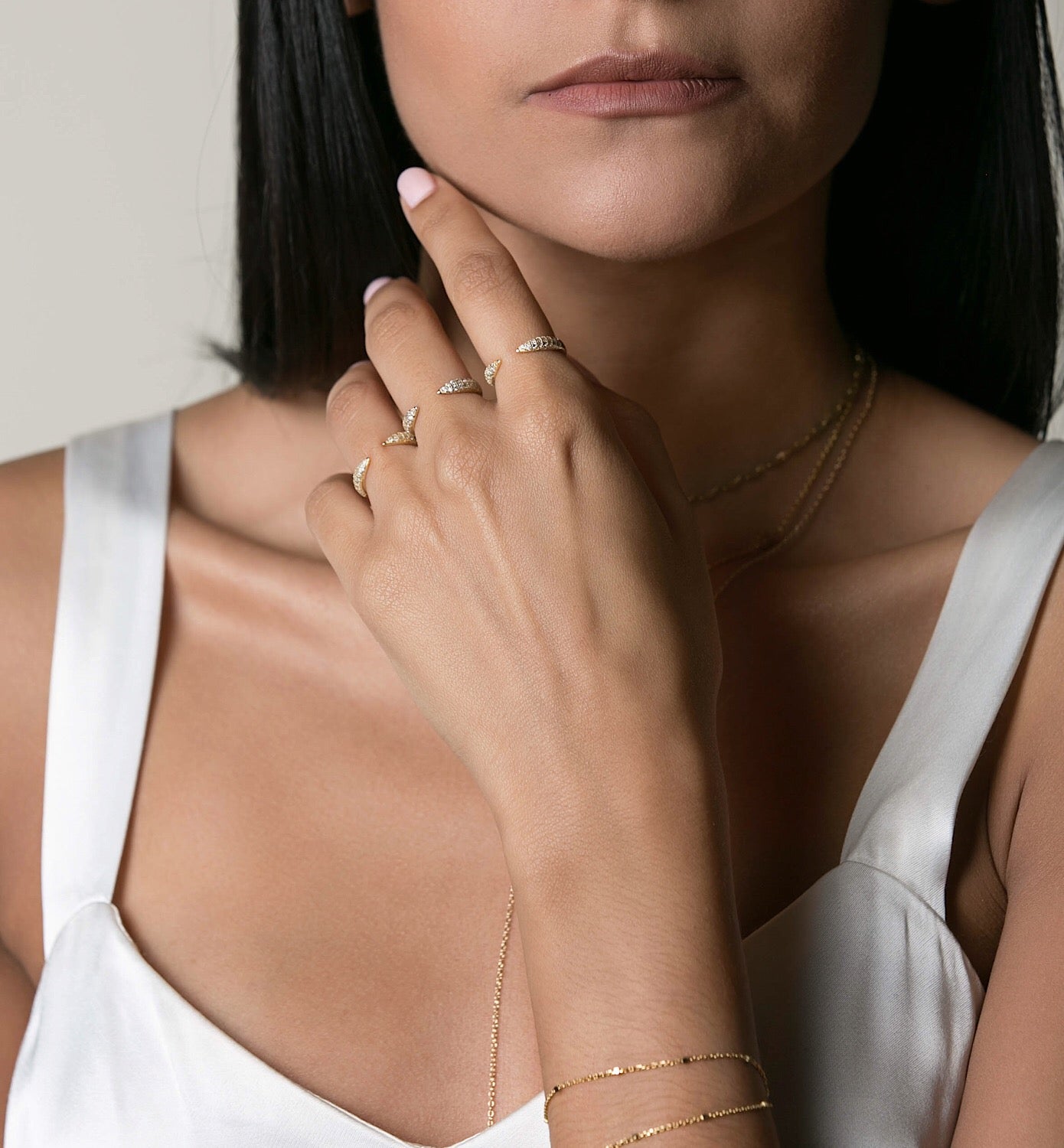 Model wearing a set of three Gold Claw Pave Rings