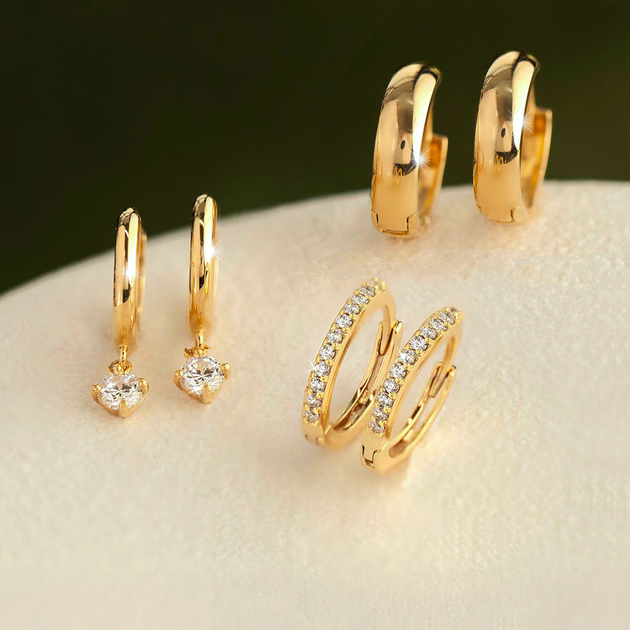 Shop AMYO’s bestselling 14K Gold Earrings with pavé sparkle, dangling drops, and timeless gold hoops designed for everyday style and gifting.