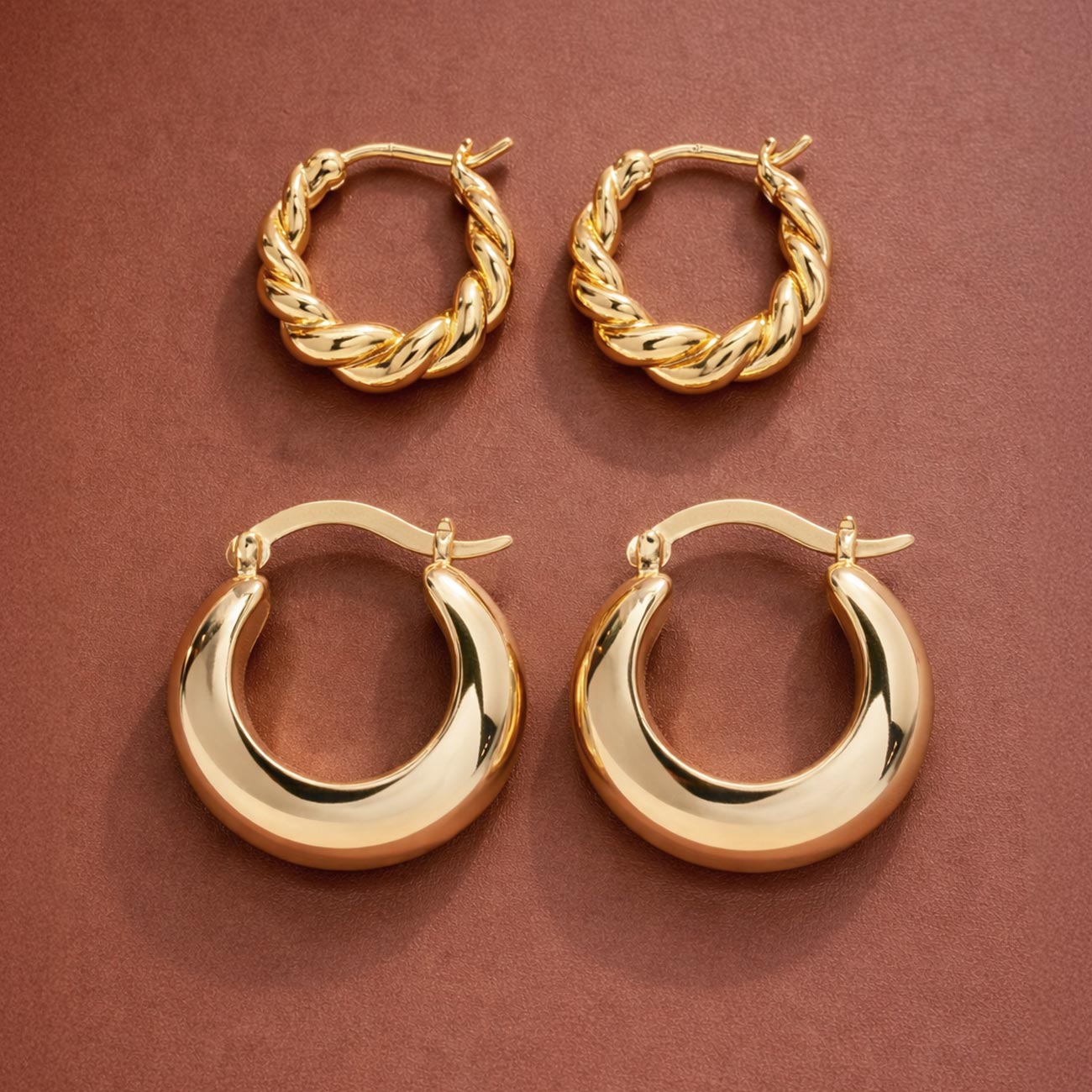 AMYO gold hoop earrings featuring polished chunky hoops and twisted rope designs, perfect for everyday styling, stacking, and timeless jewelry gifting.