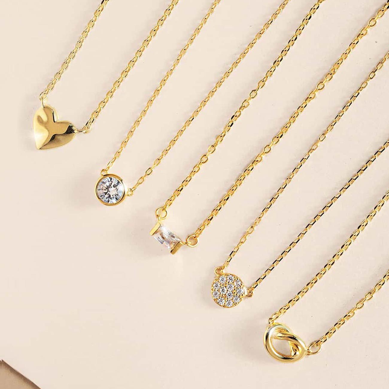 AMYO's collection of Gold pendant necklaces perfect for layering and gifting.