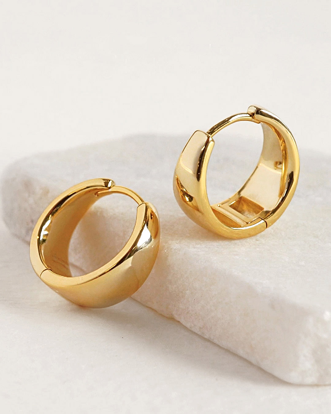 AMYO gold hoop earrings in sleek chunky design, perfect as everyday hoops for chic, modern, and timeless jewelry looks.