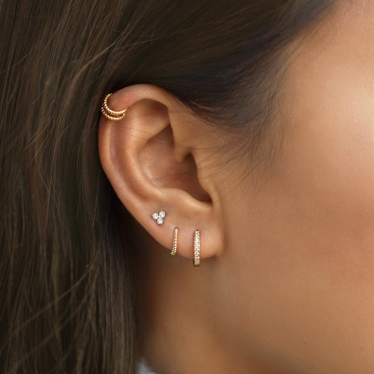 caption: Model has average sized earlobes, wearing 6mm