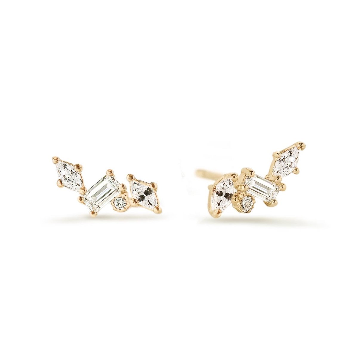 Gold vermeil cluster studs with clear marquise, baguette and round stones, on a white background