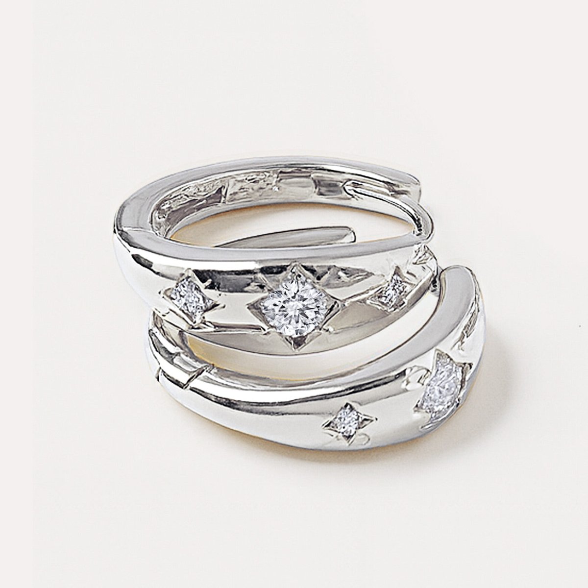 Close up shot of Celestial Mini Hoops in Sterling Silver