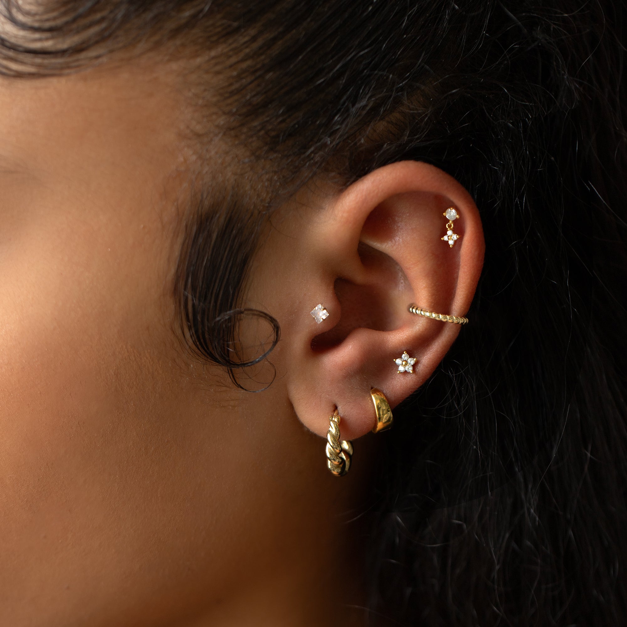 caption: Model wearing 6mm on second hole