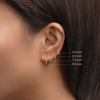 Size chart with Amyo Jewelry's Gold Vermeil Pave Huggie Earrings with CZ Crsytals. 