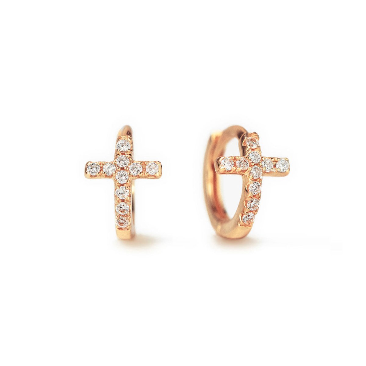 A pair of rose gold huggie earrings in the shape of a cross, each adorned with sparkling cubic zirconia stones.