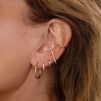 caption: Model has average earlobes, wearing 7mm on 2nd hole