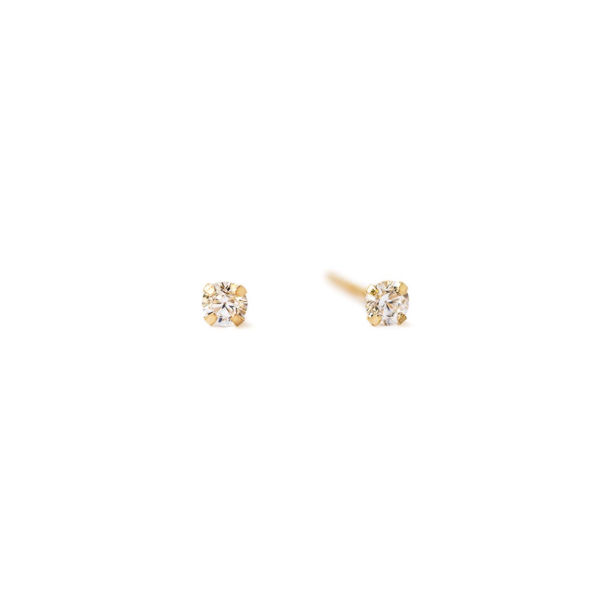 Tiny cubic zirconia stud earrings in 14k gold by AMYO Jewelry, showcasing delicate craftsmanship and refined elegance.