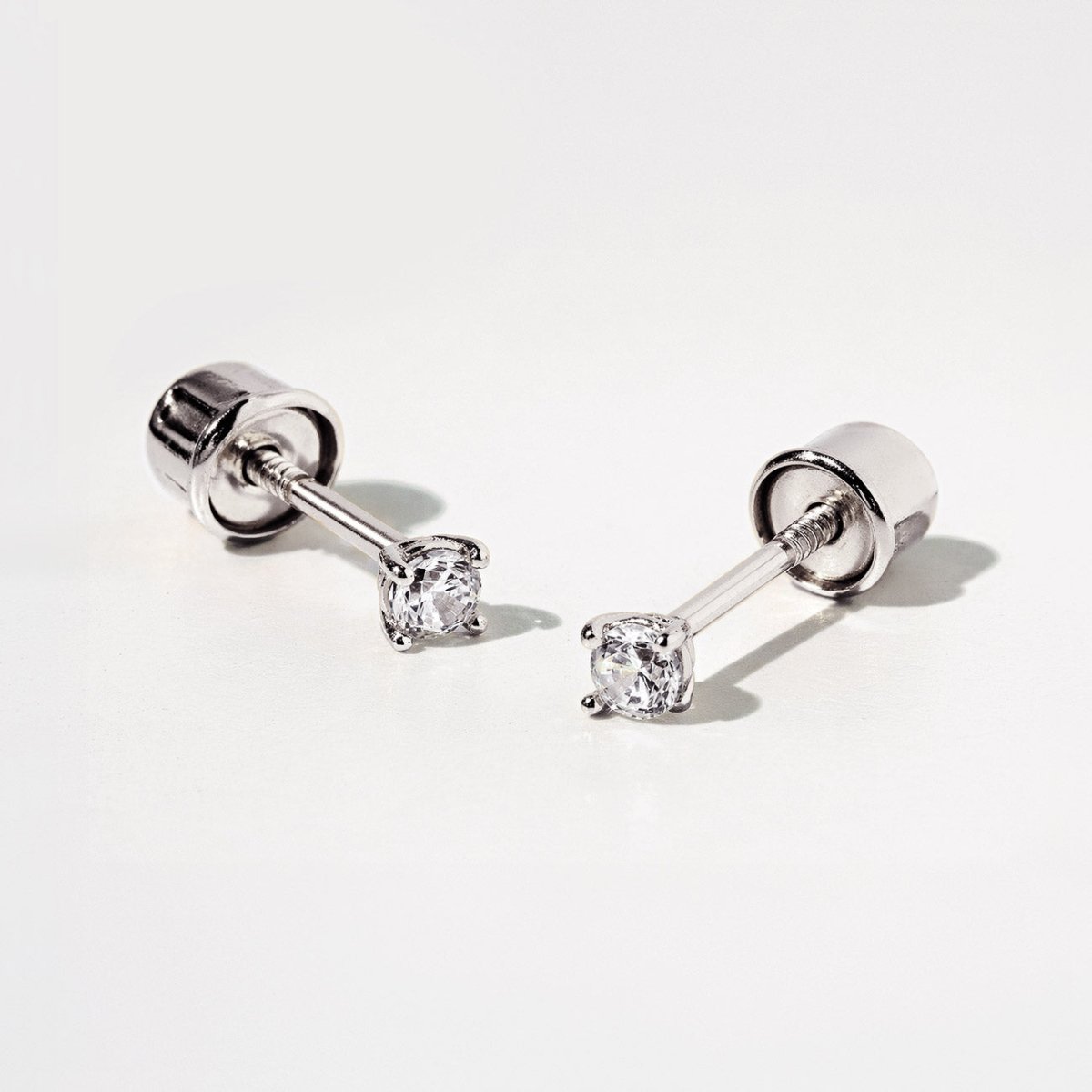Pair of 14k White Gold tiny sapphire stud earrings with screwbacks from AMYO 