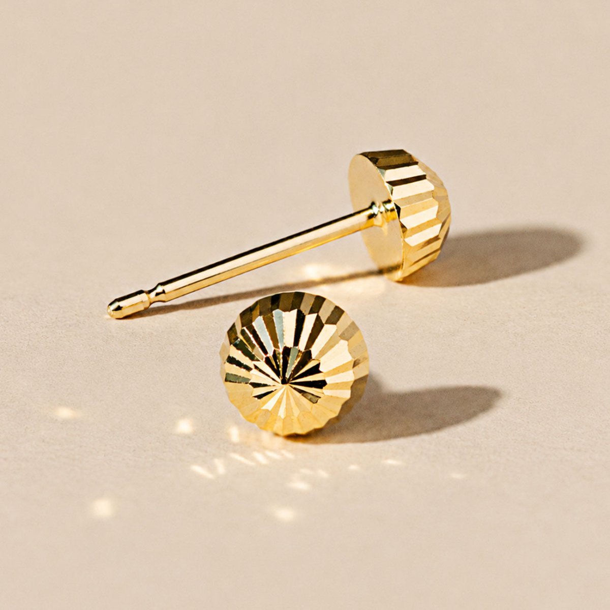 14K gold faceted ball stud earrings, close-up detail