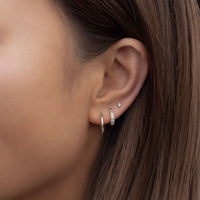 caption:Model wearing 2mm on third hole piercing