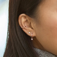 14K Rose Gold Pavé Dangle Huggie Earrings paired with stud earring 