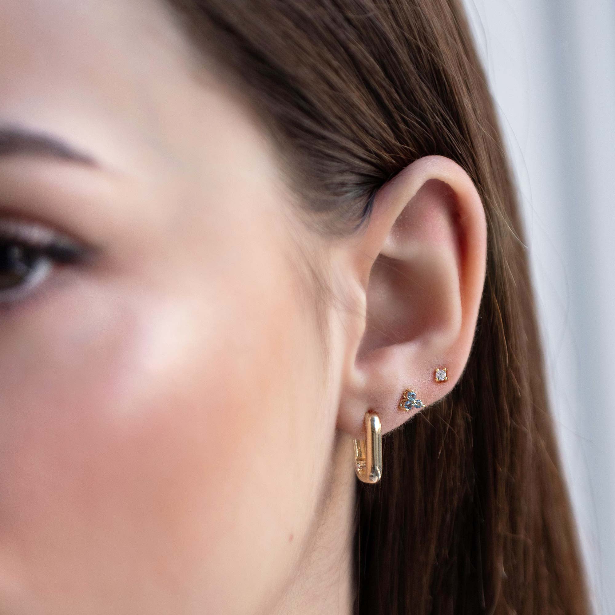 caption: Model has small earlobes