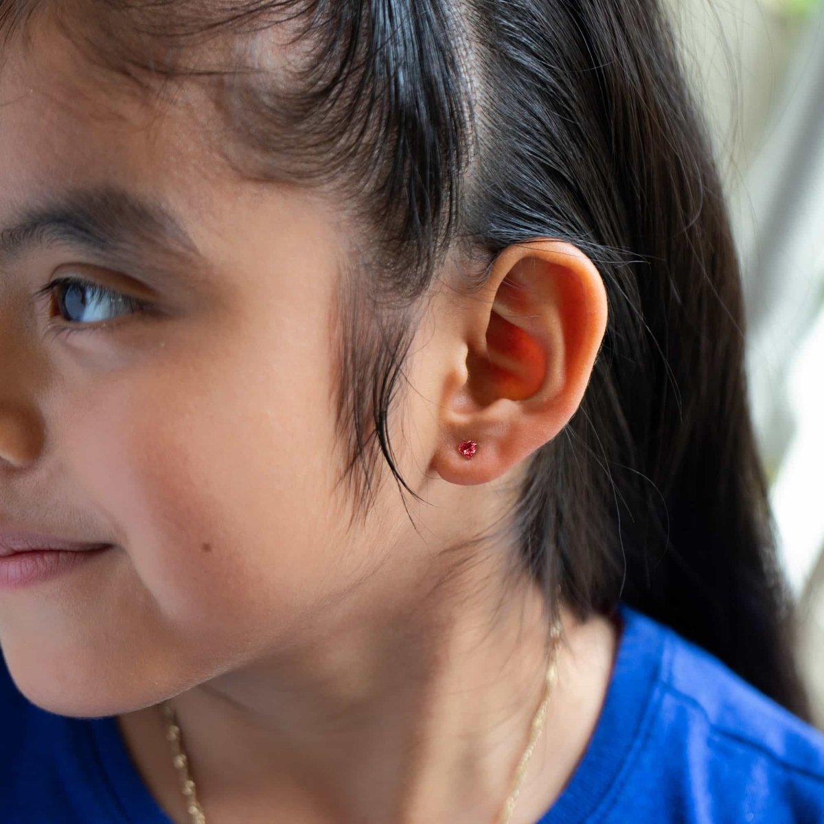 caption:Earrings on 6 year old