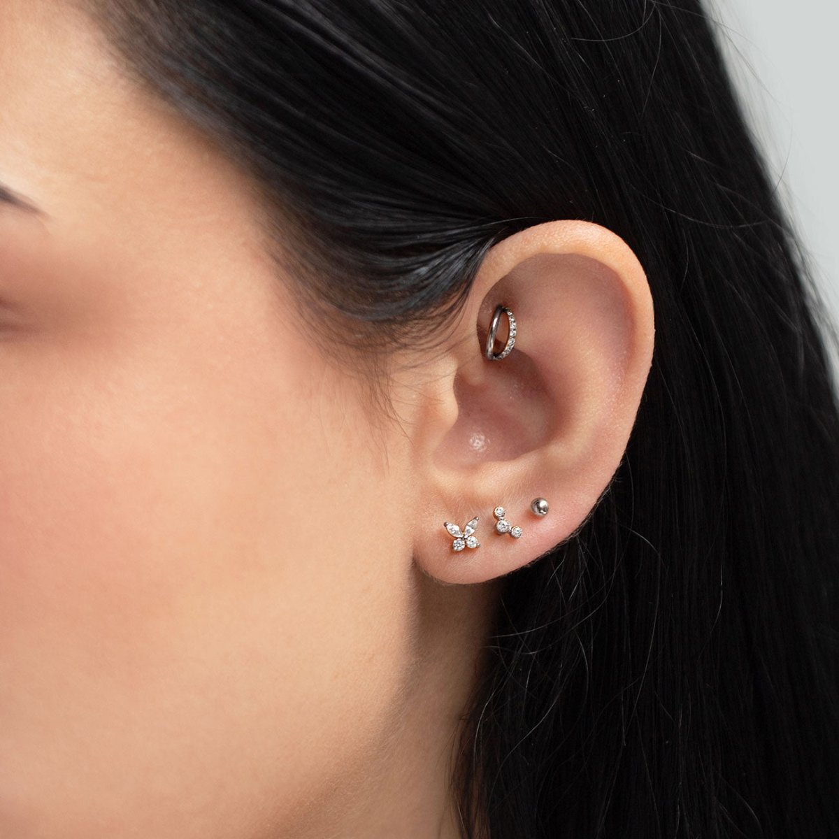 Titanium pavé hoop earrings, shown on a model