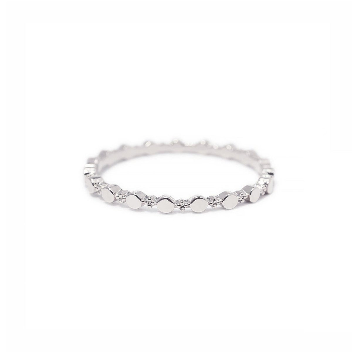 Sterling silver flat beaded stacking ring, close-up on a white background