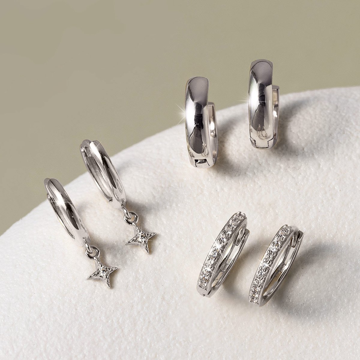 Bestselling 14K White Gold Huggie Earrings: Star Flare Huggie Earrings, Boyfriend Mini Hoops, Thin Pavé Huggie Hoops from AMYO