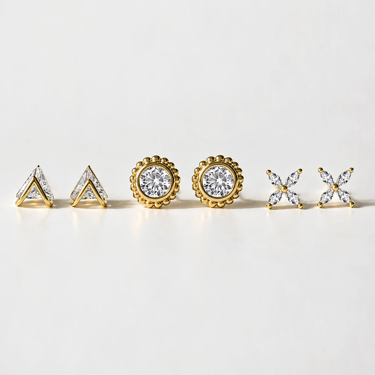 Gold vermeil stud earrings, close-up detail