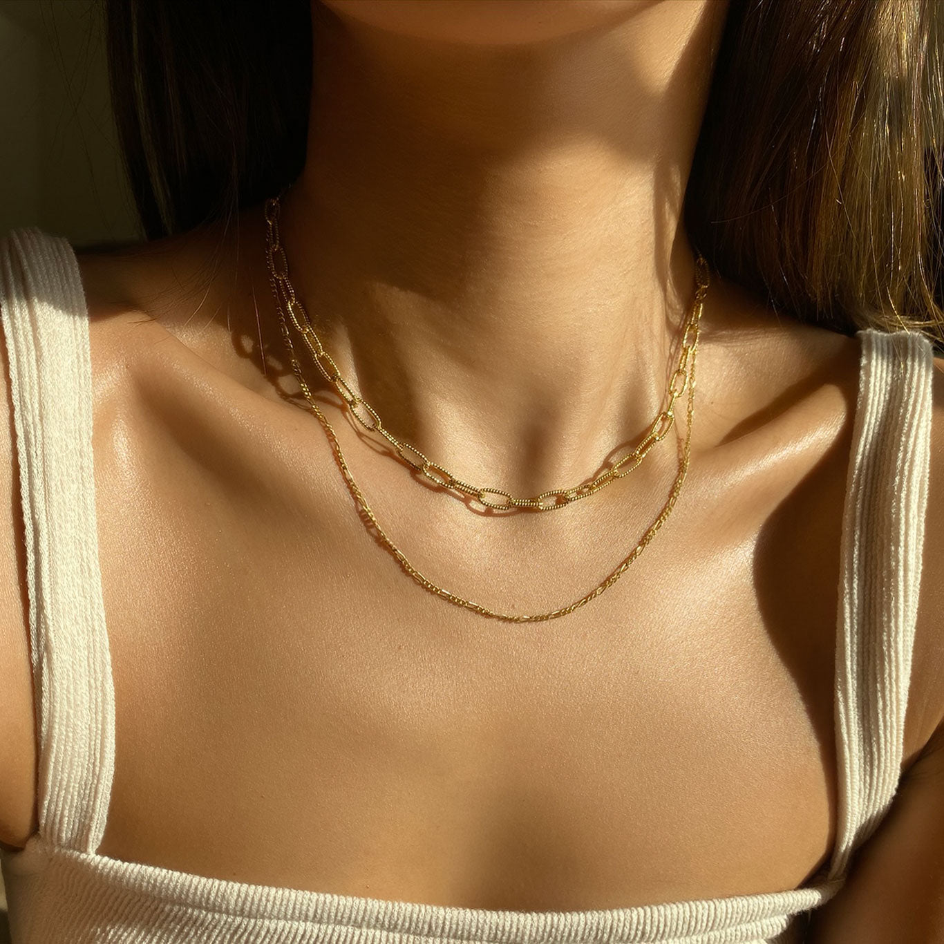 Model wearing Gold Chunky Link Chain and Figaro Layered Necklace