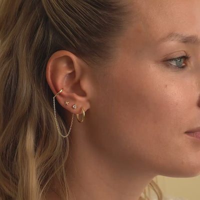 Side profile of 14K Solid Gold Mini Hoops and stud chain link. 