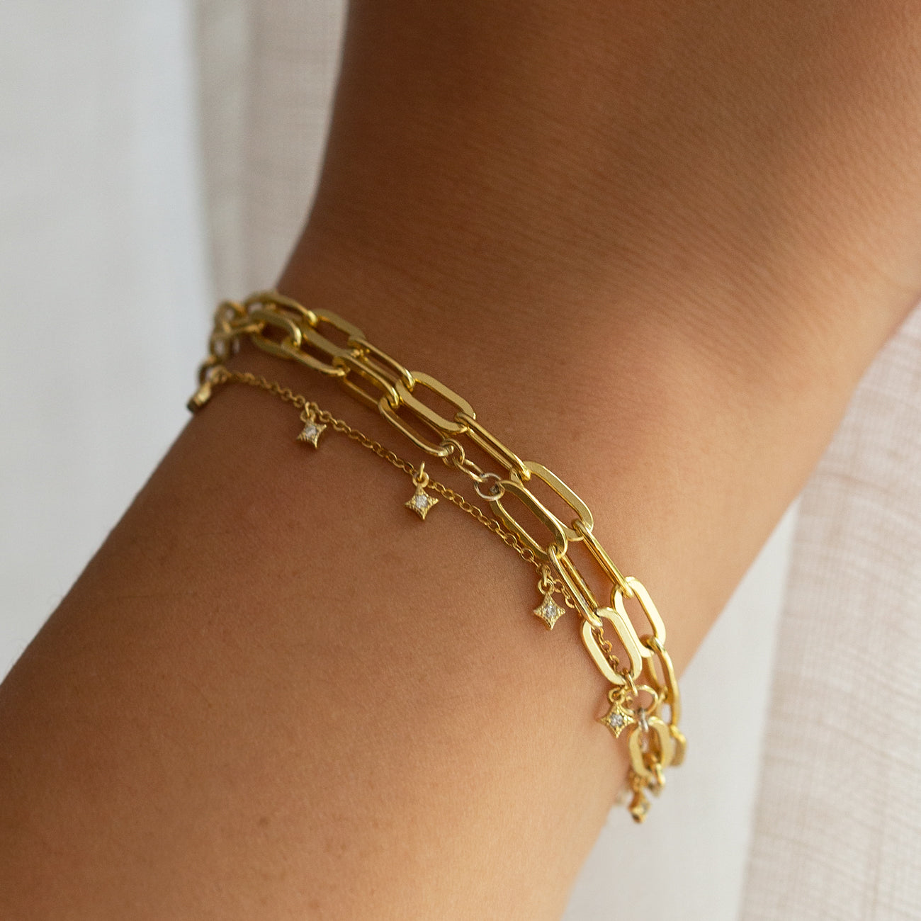 Gold Bracelet Stack paired with Gold Dangle Bracelet 