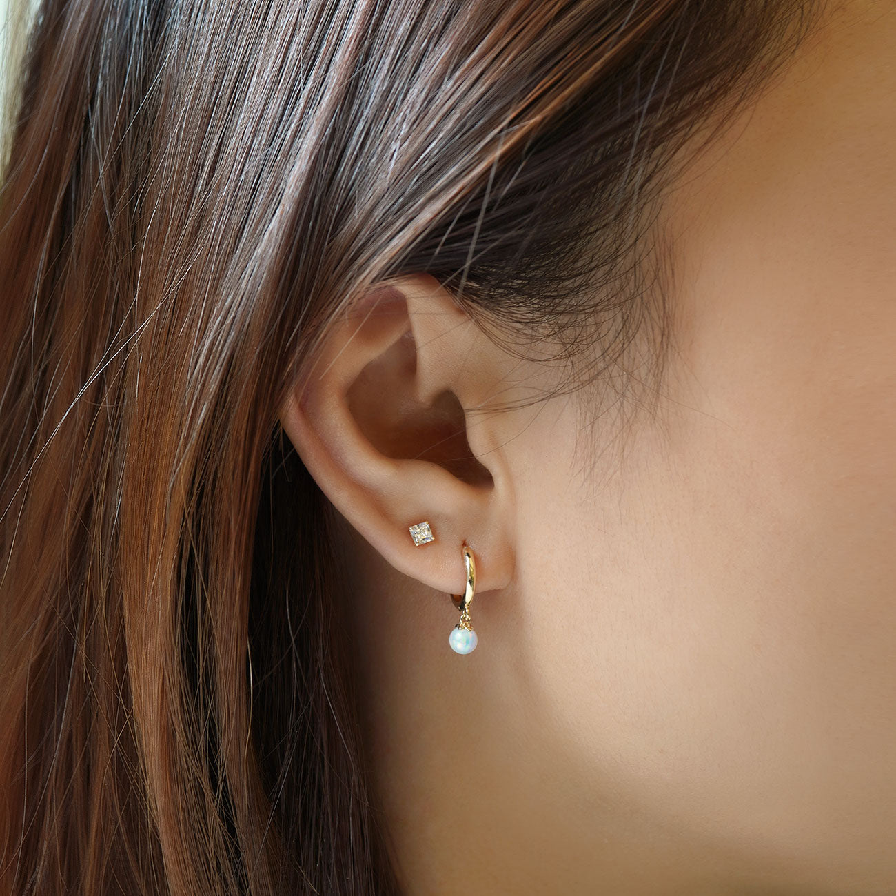 caption: Model wearing 3mm on 2nd piercing