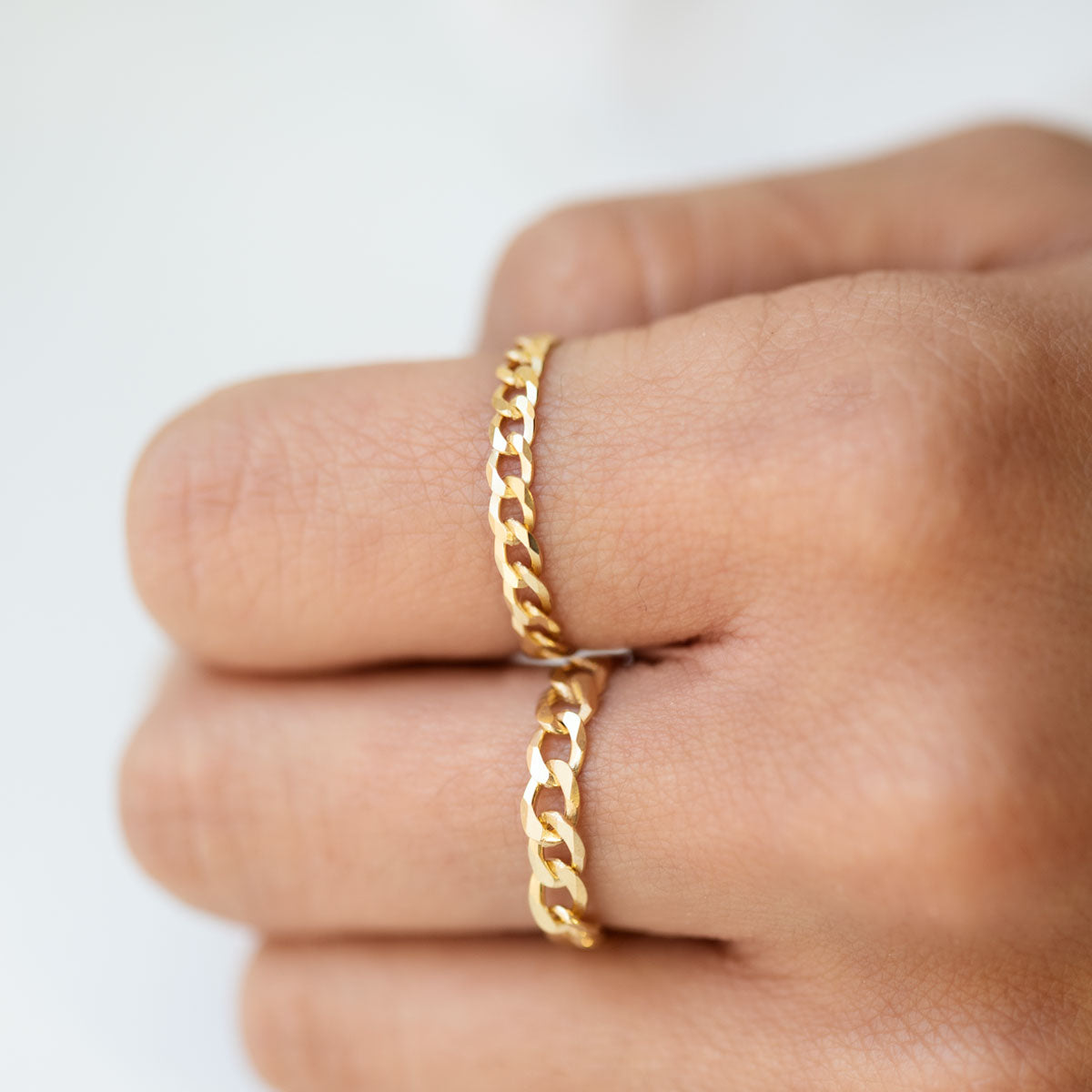Gold Curb Chain Rings worn on Index and Middle Finger